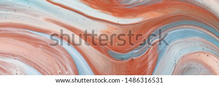 photography of abstract marbleized effect background. Blue, mint, cooper and white creative colors. Beautiful paint. banner