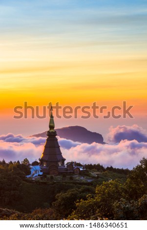 Landscape of two pagoda (noppha methanidon-noppha phon phum siri stupa) in sunrise time with mist in the backgroundat at Inthanon mountain, chiang mai, Thailand Royalty-Free Stock Photo #1486340651