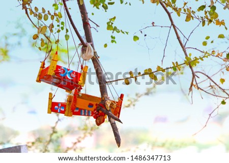 Traditional Swings are tied on tree