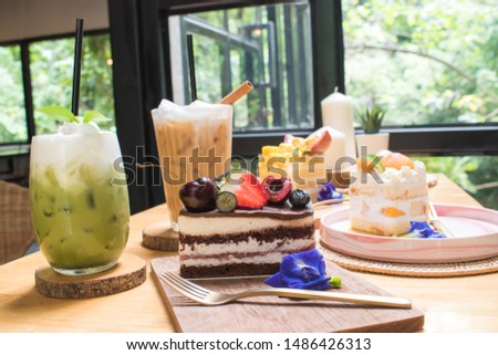 Picture of 3 cakes with coffee and green tea, fresh milk ready to be served in a coffee shop.