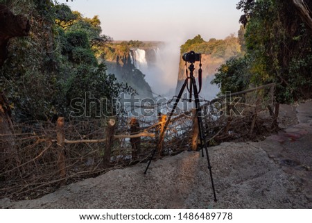 Victoria Falls and a Professional SLR Camera Set Up on a Tripod