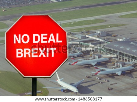 No Deal Brexit digital composite sign with high perspective view of airport terminal in background. UK is set to leave the EU by default on October 31st, 2019 leading to disruptions in travel