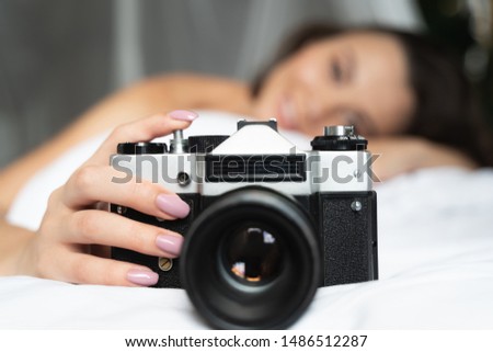 Close up of female hand with vintage camera stock photo