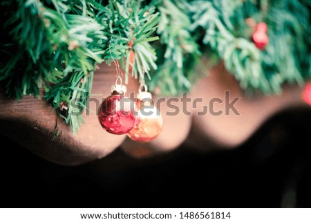 Close up of Christmas decoration on the Christmas market. Christmas bauble on a fir branch.