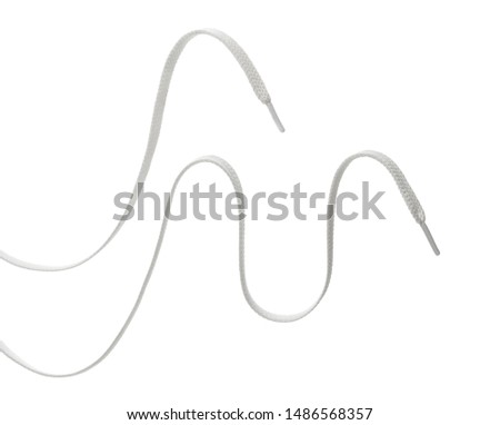 two long white textile shoelaces, hanging in the air, isolated on white background Royalty-Free Stock Photo #1486568357