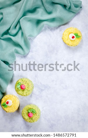 Tea cup with herbal tea and colorful cakes. Tea party concept, top view