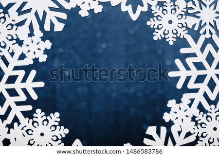 Frame of white wooden snowflakes. Christmas decor