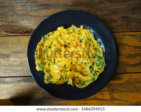 Picture of an omelette made from organic eggs with a mixture of spring onions