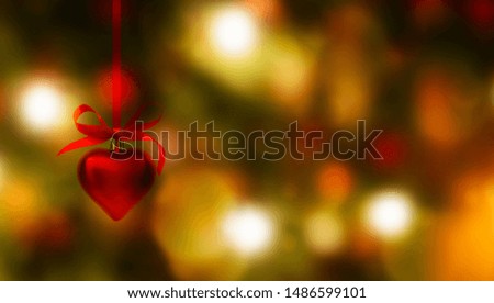 heart shape christmas decoration on shiny blurred festive background
