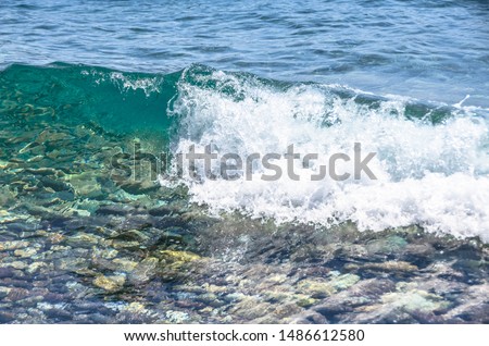 Close up to small wave in sea near Bodrum, Turkey
