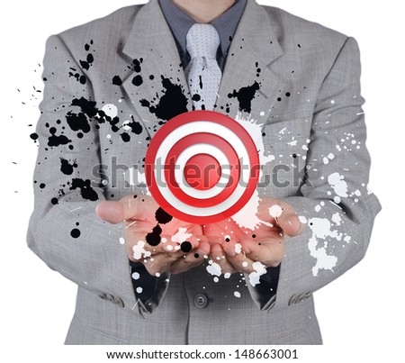 businessman hand shows target symbol and splash color as concept