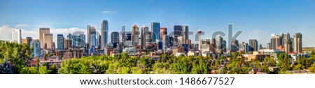 Panoramic view of Calgary Alberta Skyline from the South at Sunset Royalty-Free Stock Photo #1486677527