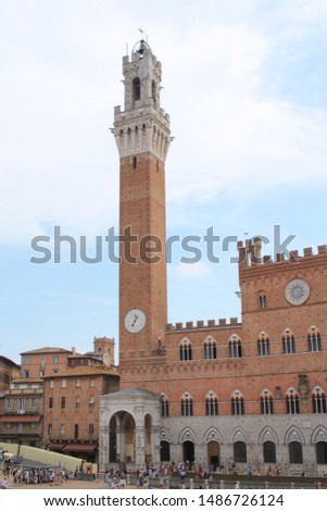 Piazza del Campo with the Pubblico palace and Mangia tower , the principal public space of the historic center of Siena, Tuscany, Italy. It is regarded as one of Europe's greatest medieval squares

