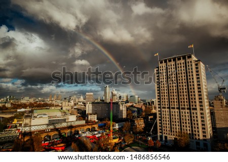 LONDON, England UK, September 22 2016:Elevated view of The City of London with rainbow in the sky