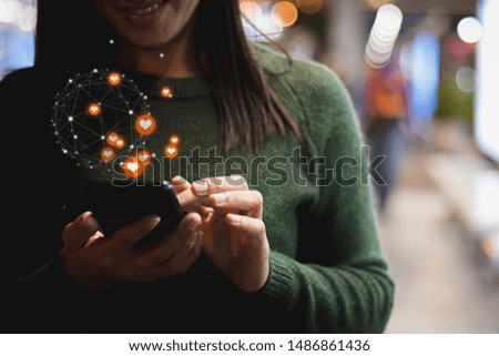 Asia woman using smartphone working ,playing in free time with happy