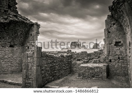 View of Irish cathedral ruins from the ruins of an Irish castle Royalty-Free Stock Photo #1486866812