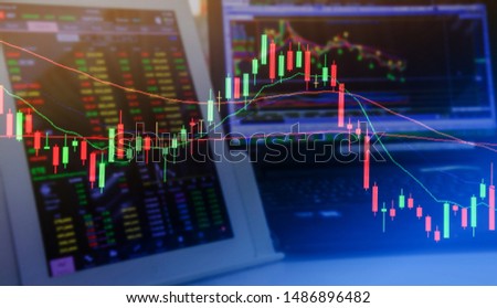 Double exposure. Technical candlestick price chart, up and down trend, volatility, panic sell, red selling stock ticker trading data on computer screen background. Economic and business crisis concept Royalty-Free Stock Photo #1486896482