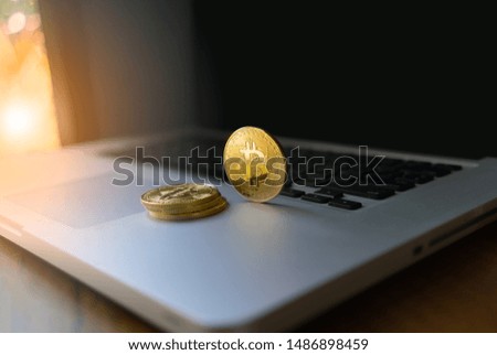 Golden coin symbol Bitcoin on labtop.Virtual cryptocurrency and blockchain concept.