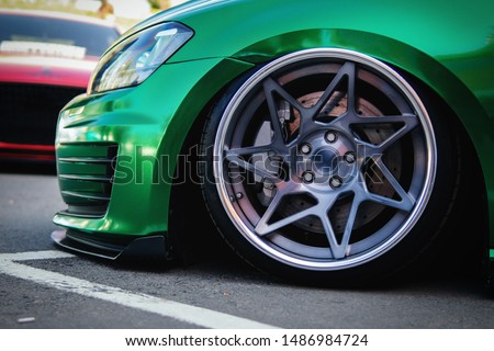 Lowrider custom stance stylish sports car closeup Royalty-Free Stock Photo #1486984724