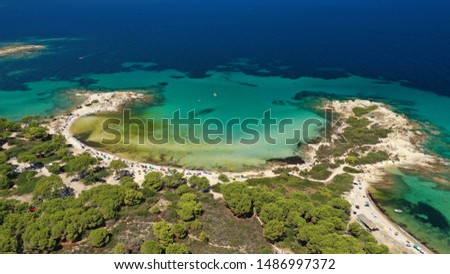 Aerial drone view of iconic turquoise paradise bay and twin beaches of Karidi and small Karidi, Sithonia peninsula, Halkidiki, North Greece