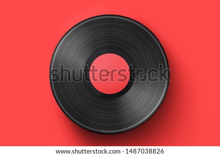 Vinyl record on a colored background. Old vintage vinyl record isolated Royalty-Free Stock Photo #1487038826