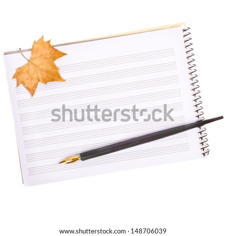 theme music, the notebook for notes, for musical recordings, old pen and autumn leaves isolated on white background