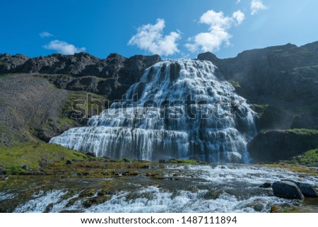 Dynjandi foss cascade waterfall with mossy canyon in the foreground  at the Westfjords of Iceland