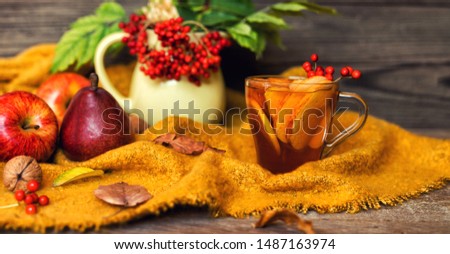 Cup of autumn tea and yellow dry leaves. Hot drink for autumn cold days. Concept autumn mood.