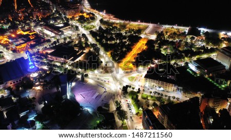 Aerial drone night shot of central downtown area of Salonica or Thessaloniki featuring OTE Hellenic telecommunications tower and HELEXPO International Exhibition Centre, North Greece