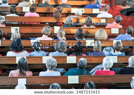 Top view on a Christian community at a church service or concert in a church - selective focus Royalty-Free Stock Photo #1487215415