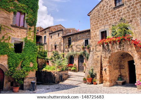 Picturesque corner of a quaint hill town in Italy Royalty-Free Stock Photo #148725683