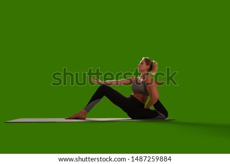 Yoga woman isolated on green screen.