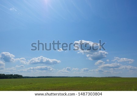 Blue blue sky with clouds. Beautiful countryside landscape.