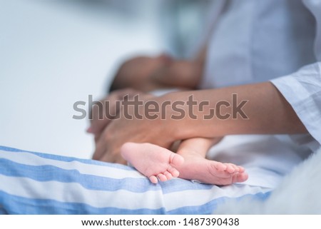 baby infant in blue diaper