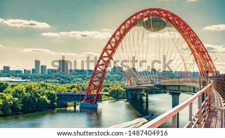 Picturesque (Zhivopisny) bridge over the Moscow river on sunset. The picturesque bridge is a cable-stayed bridge over the Moscow river, the highest bridge of this type in Europe. Royalty-Free Stock Photo #1487404916