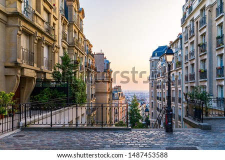 Montmartre district of Paris. Morning Montmartre staircase in Paris, France. Europa. View of cozy street in quarter Montmartre in Paris, France.  Royalty-Free Stock Photo #1487453588