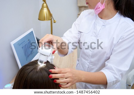Diagnostic complex for microscopic examination of hair and skin of the scalp. Royalty-Free Stock Photo #1487456402