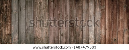 Vintage dark wooden fence texture.Urban grunge background. Punk grunge texture. Colorful background