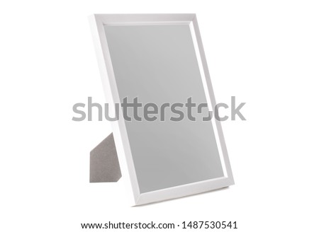 White desktop photo frame at an angle isolated on white background
