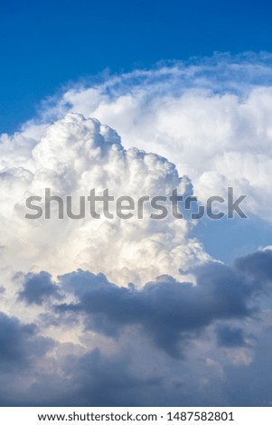 Cumulus clouds and blue calm sky