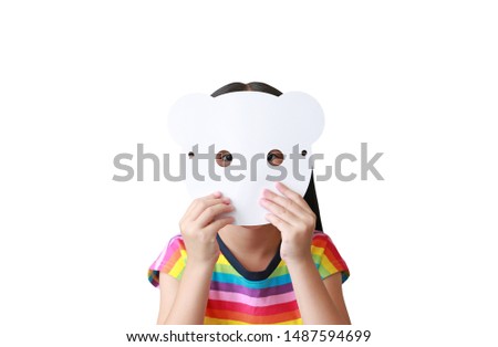 Cute little child girl holding blank white animal paper mask fronting her face isolated on white background. Idea and concept for animal face.