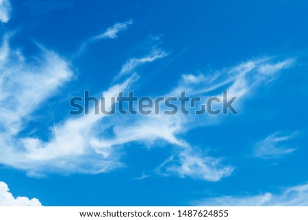Beautiful sunny blue sky with clouds background. Abstract nature texture pattern with panoramic view of puffy fluffy cloudscape in tropical summer or spring morning sunlight & sunshine day, copy space