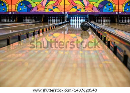 View down bowling alley with gutter guards in place 