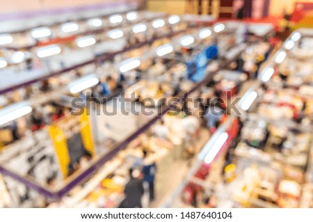 Abstract blurred image of Shopping mall or Exhibition hall with bokeh  for background usage.