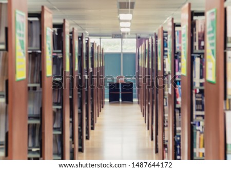 Picture of blur bookshelf as background in library with copy space. Photo concept of education, knowledge, traditional learning, and literature.