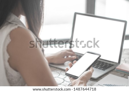 Mockup image of close up business woman working with smartphone laptop and documents in office, mockup concept