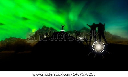 Silhouette male hiker groups celebrating success on top of a mountain in a majestic Northern lights and climber helping to hike up . Concept for success ,help,teamwork and Leadership concept .