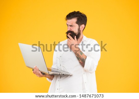 In search of inspiration. Online payment. Online purchase. Digital world. Programming concept. Programmer with laptop. Bearded man with notebook. Online shopping. Man using notebook. Surfing internet.
