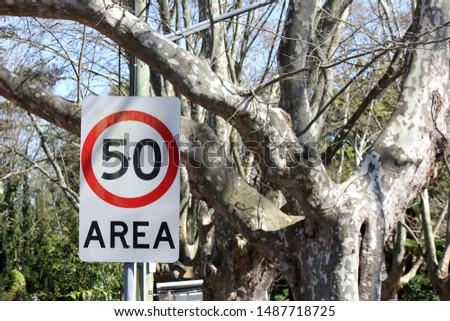 50km Road Sign in Residential Area near Park