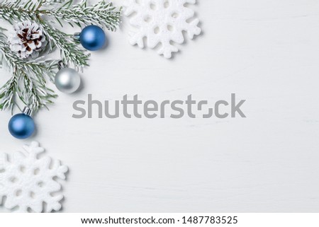 Bright Christmas composition, blank for design - snowflakes, Christmas tree branches and cones, copy space, place for text, flatlay